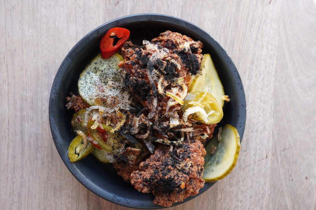 Crispy chicken bites with hot honey and pickles